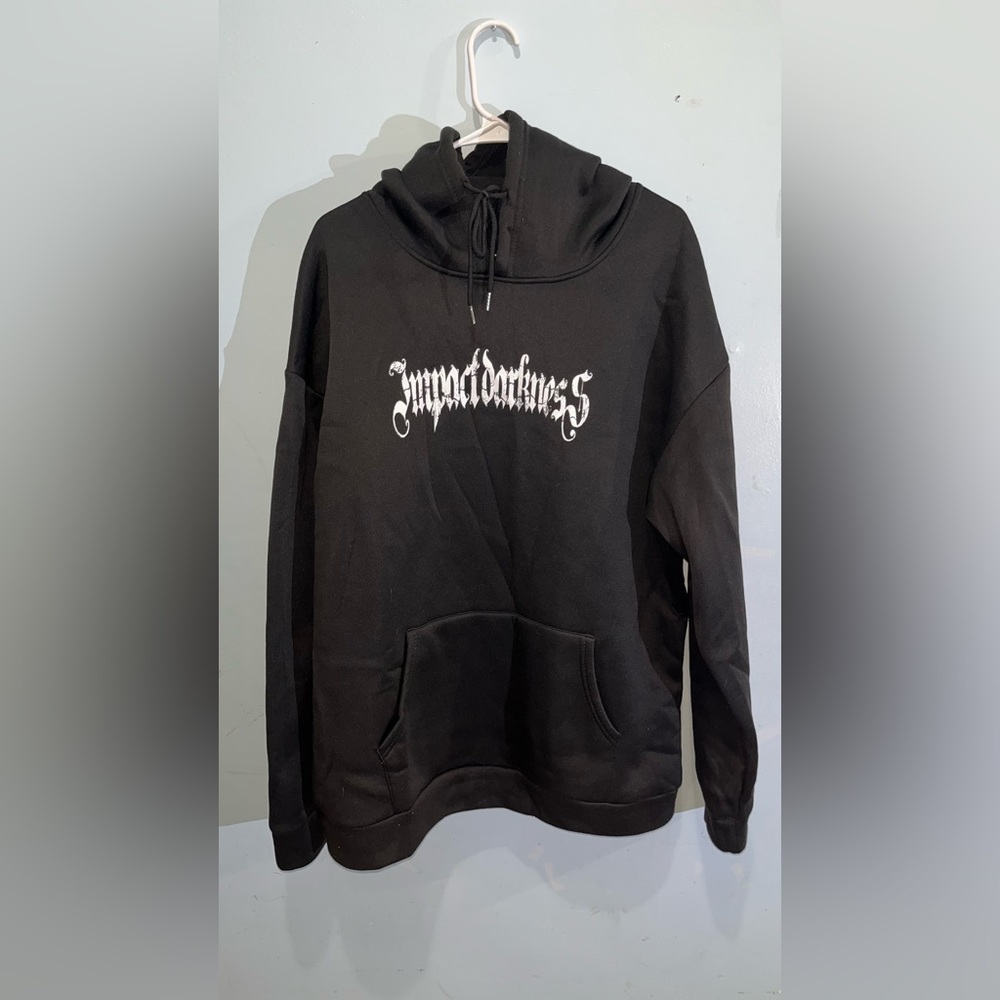 Black and white hoodie with design in the front and back. Very warm inside.